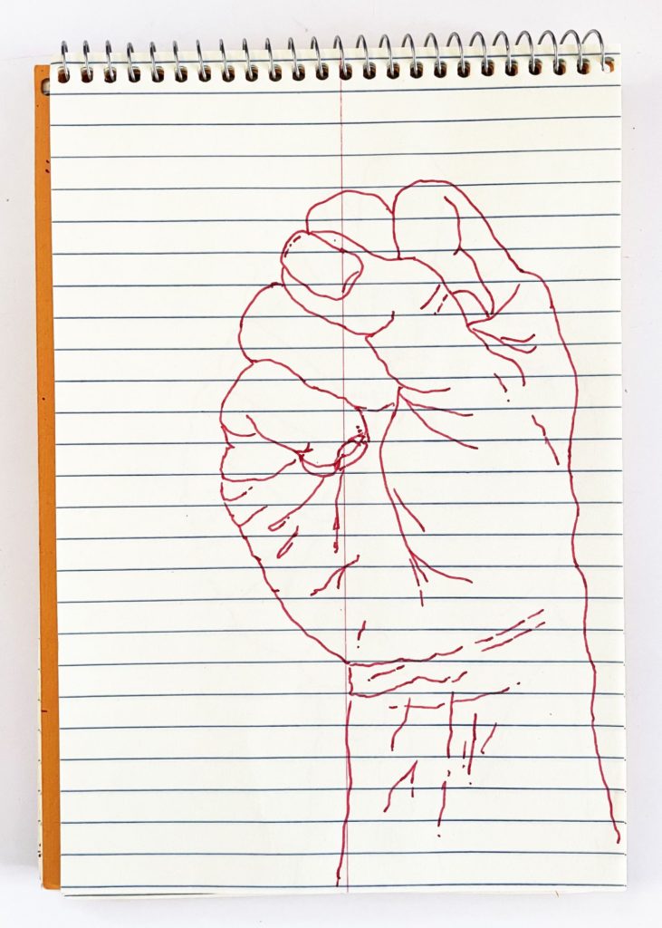 an outline handsketch of a hand shaping the ASL American manual letter “S”, in red ink on a yellow spiral bound steno notebook. 