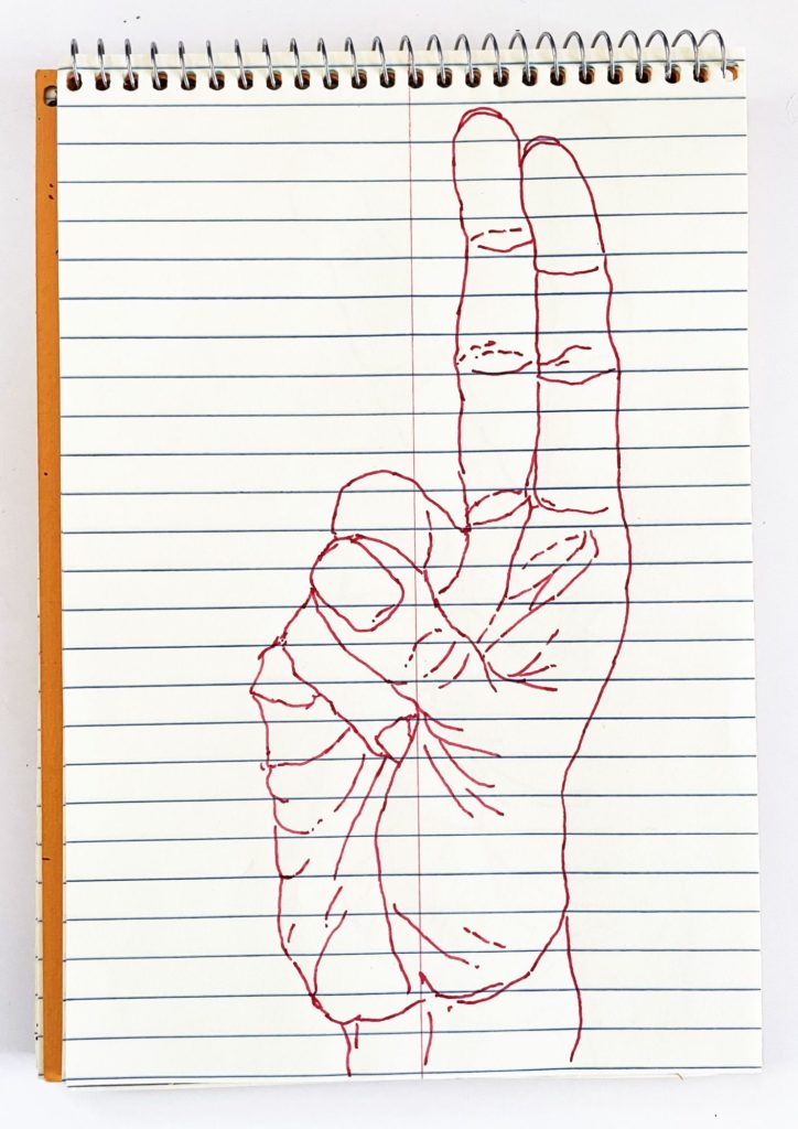 An outline handsketch of a hand shaping the ASL American manual letter “U”, in red ink on a yellow spiral bound steno notebook. 