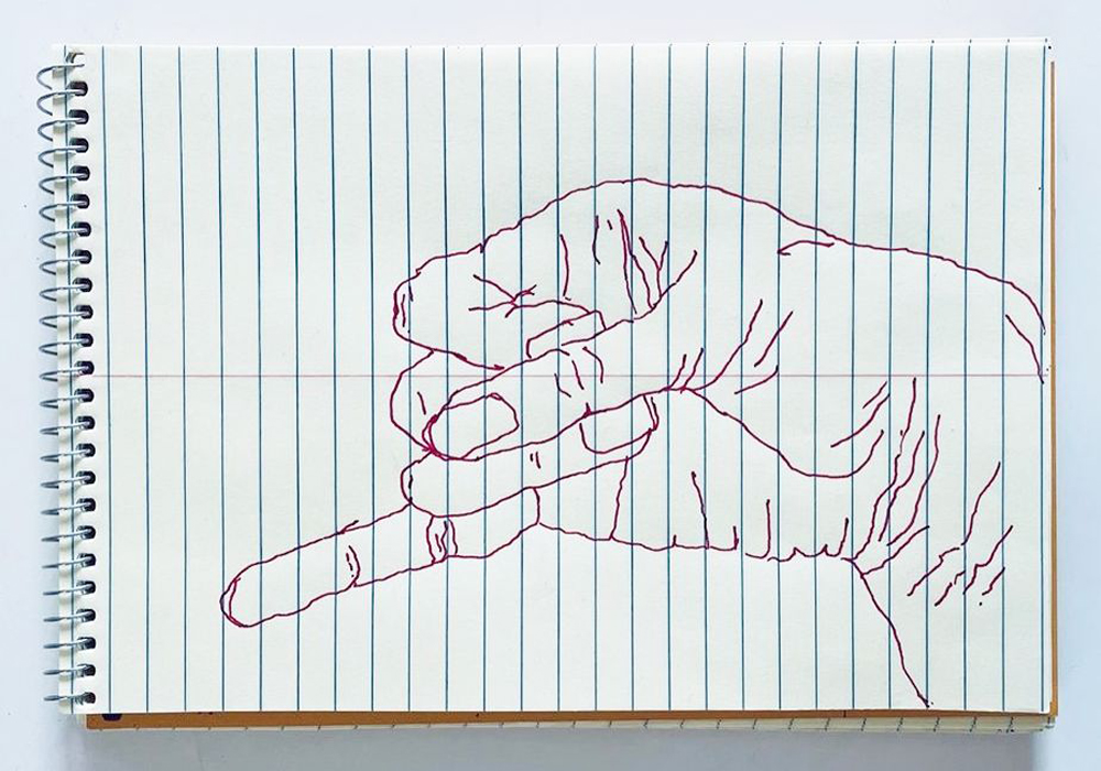 An outline handsketch of a hand shaping the ASL American manual letter “J”, in red ink on a yellow spiral bound steno notebook. 