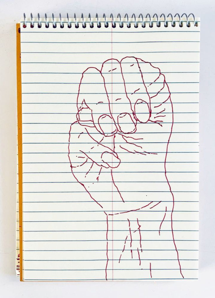 An outline handsketch of a hand shaping the ASL American manual letter “M”, in red ink on a yellow spiral bound steno notebook. 