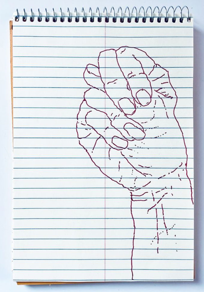 An outline handsketch of a hand shaping the ASL American manual letter “N”, in red ink on a yellow spiral bound steno notebook. 